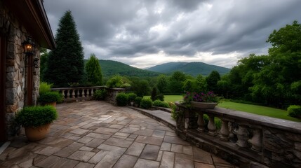 Obraz premium Elegant stone patio overlooks a lush landscape under dramatic cloudy skies