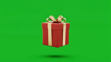 A vibrant red Christmas gift box with a golden ribbon floating in the air against a green background, perfect for holiday promotions