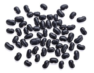 Black beans scattered on a white background, overhead view