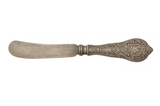 Ornate antique butter knife featuring a decorative, detailed handle design, vintage silver cutlery on transparent background