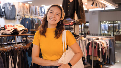 Young teen Gen Z asia female happy smile looking at camera at zero waste eco go green buy second...