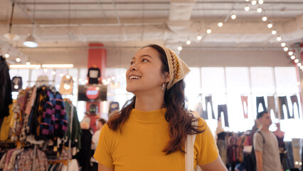 Young teen Gen Z asia female happy travel smile looking at zero waste eco go green buy second hand...