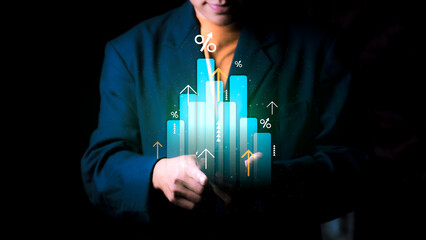 Stable business growth concept. A businessman shows a digital bar chart which represents big data analysis, financial forecast, and interest rate trend through a smart investment strategy.