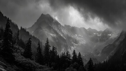 Dramatic dark mountain range under heavy storm clouds with rugged peaks and moody atmospheric sky over remote wilderness