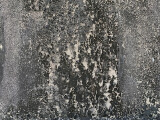 water drops on black background. The peeling paint on the walls is caused by water or moisture seeping into the walls, causing further damage. This requires proper repair.