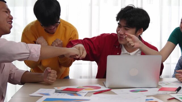 Excited and happy startup company employee celebrate after make successful strategic business marketing planning. Teamwork and positive attitude create productive and supportive workplace. Synergic