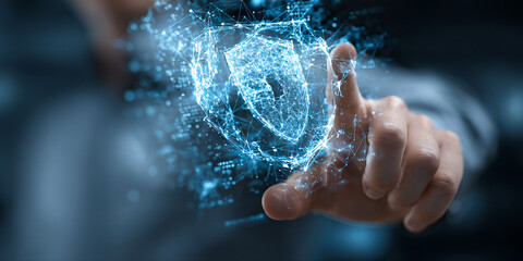 Person interacting with digital shield symbolizing cybersecurity and protection in modern environment
