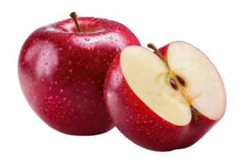 Shiny red apple whole and halved on black background