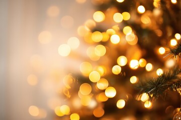 Obraz premium Golden light bokeh creating a festive and abstract Christmas background, featuring blurred tree branches and ample copy space