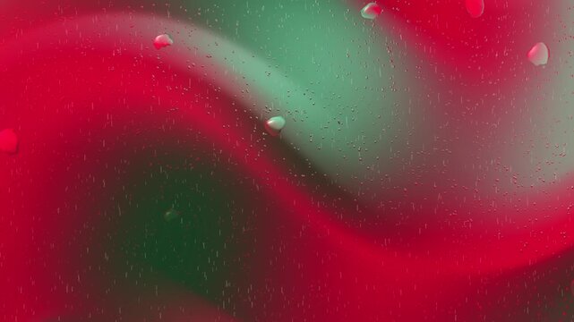 Red and green blend with water droplets ideal for holiday backgrounds, naturethemed designs, festive greeting cards, and printables.