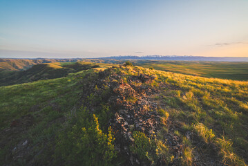 Rocky Ridge Top And Stunning Sunset Prairie