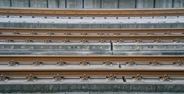 Pattern of railway tracks as a side view. Steel construction of railroad tracks.