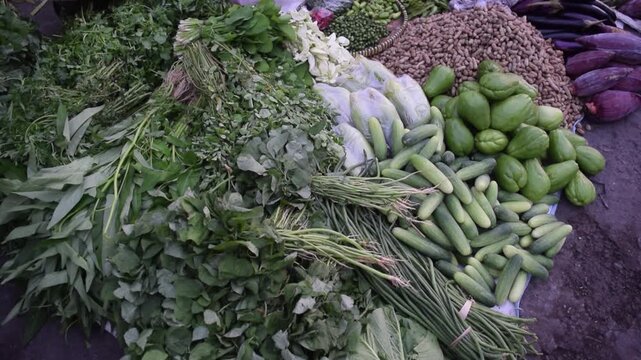 Fresh Harvest: Vibrant Vegetables at a Bustling Market Display