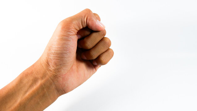 Close-up hand gesture forming a knocking motion, isolated on white studio background.