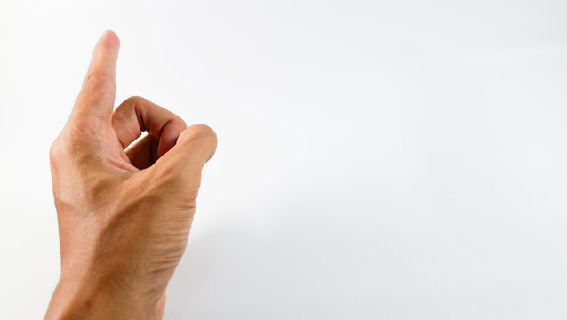 Hand gesture showing one finger pointing upward on a white background, symbolizing direction, idea, or attention.