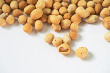 Golden Crunchy Coated Nuts on White Surface