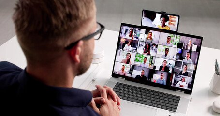 Multitasking Man Balances Movie And Video Conference Call