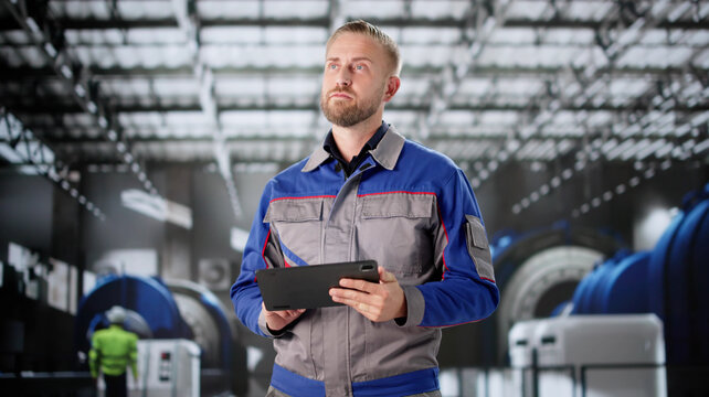 Young Male Engineer Inspecting Pipes For OSHA Regulations