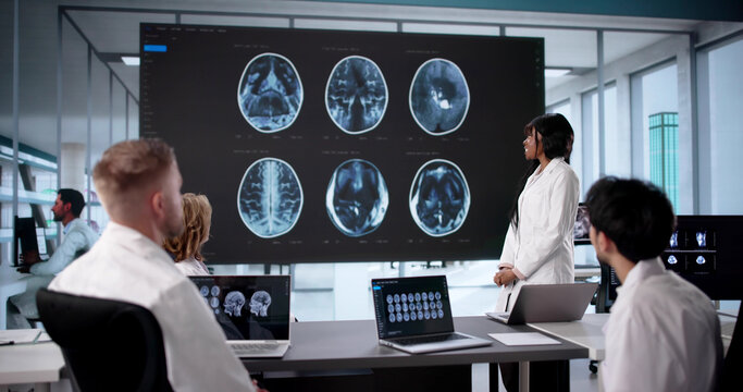 Medical Team Examining MRI Scan For Neurology Treatment