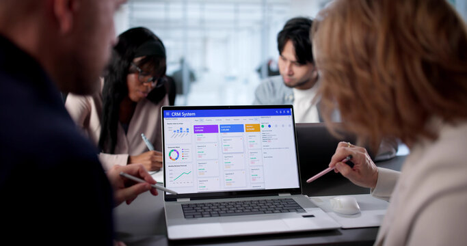 African American Man And Woman Using CRM Software - Powered by Adobe