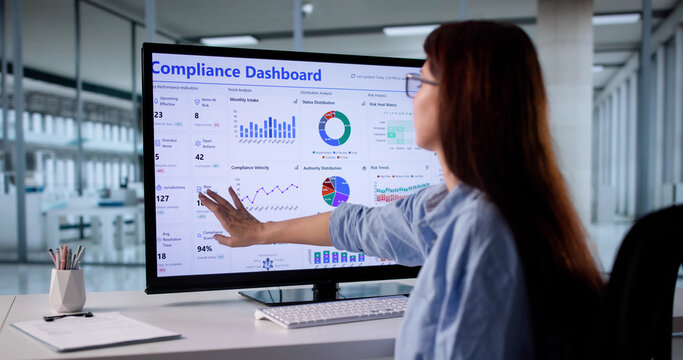 Female Regulatory Compliance Officer Ensures Legal Assurance Through Data