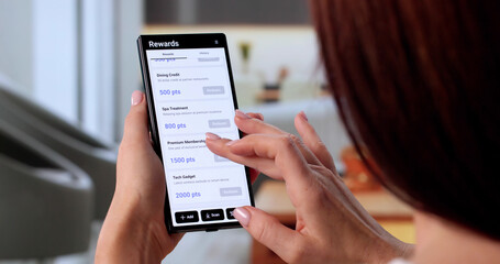Businesswoman Showcases Loyalty Points App On Phone