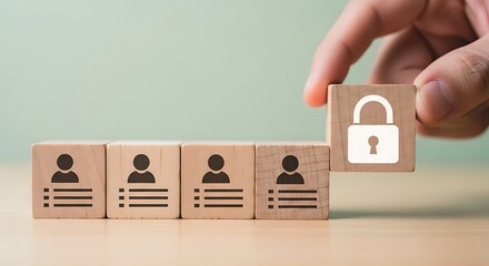 Hand placing wooden block with padlock icon next to blocks showing user profile icons, symbolizing data security
