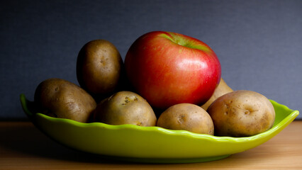 Placing an apple with our potatoes helps in slowing down the sprouting of potatoes tubers.