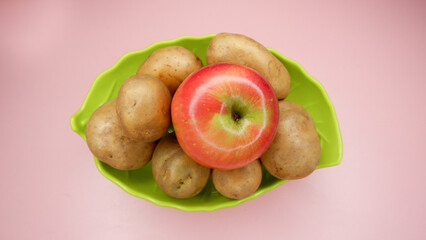 Placing an apple with our potatoes helps in slowing down the sprouting of potatoes tubers.