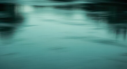 Abstract motion blur of teal water surface creating a moody atmosphere