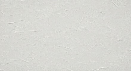 Close up of a textured, offwhite paper surface with subtle wrinkles