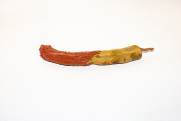 Tamarind is a tangy, sweet-sour tropical fruit used in cooking, drinks, and traditional remedies.
