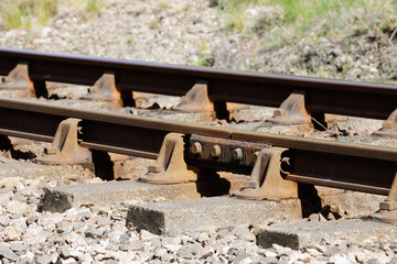 Metal railway track rails and concrete sleepers