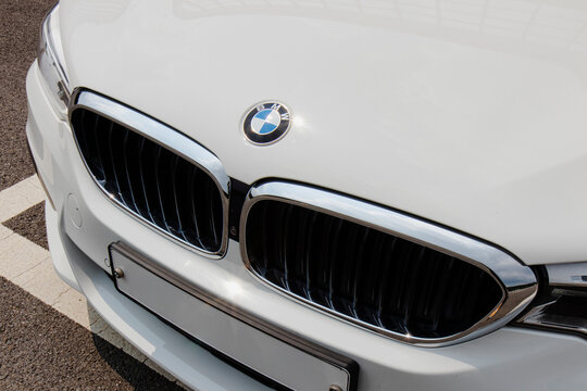 Close-up of front grille and BMW logo on white sedan - Seoul, South Korea - August 26 2022