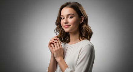 Naklejka premium Portrait of a confident young woman with gentle smile and elegant