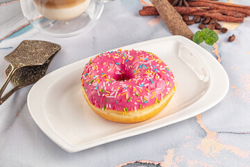 Sweet donut with strawberry icing