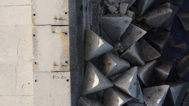 Close detailed view of old metal surface with sharp pyramid studs, industrial texture, weathered steel patterns and strong geometric shapes
