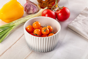 Ripe juicy yellow cherry tomato