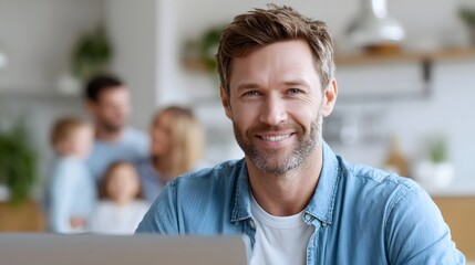 Smiling man working on laptop at home family blurred in background Represents modern home life work life balance and domestic happiness combining work and family in a contemporary setting