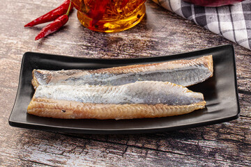 Marinated pickled salted herring fillet