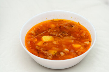 Hearty bowl of Borscht, filled with vegetables and savory flavors, ready to enjoy