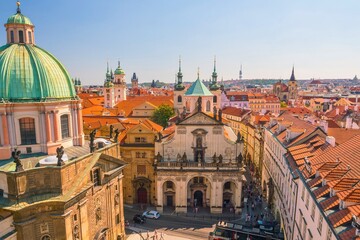 Historic european cityscape with green domes and red roofs