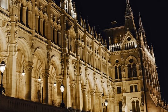 Ornate gothic architecture illuminated at night - Powered by Adobe