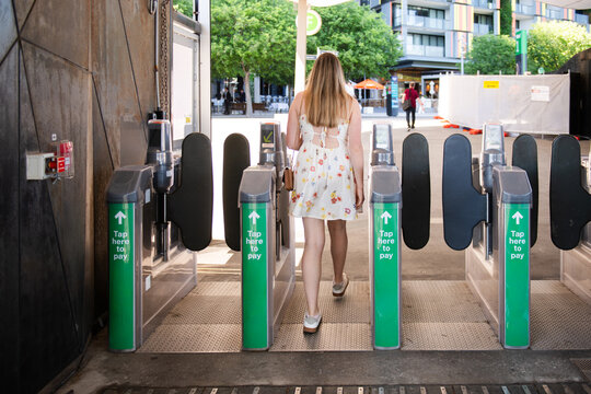 woman tapping off at ferry terminal
