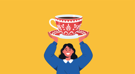 Cheerful woman with a bright smile wearing a blue sweater holds a large red patterned teacup and saucer above her head.