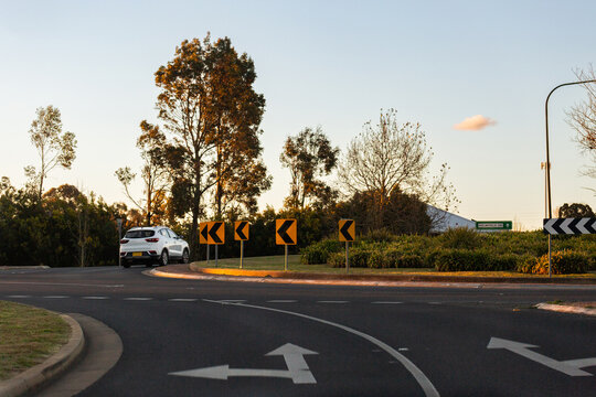 Car passing through roundabout in the New England area rear Armidale