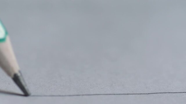 Macro Slow Motion of Pencil Drawing Straight Line on White Paper, Creative Sketch Concept