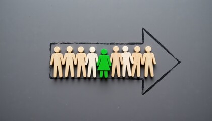Diverse Group of Wooden Figurines with a Unique Green Figure Representing Individuality and Inclusion in a Team Setting