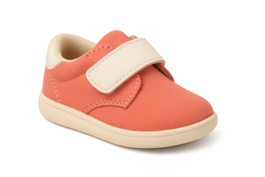Coral pink toddler sneaker with white velcro strap, offering comfort and style for infants and young children, transparent background