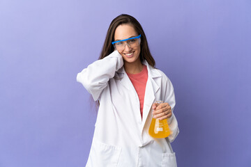 Young scientific woman over isolated background laughing